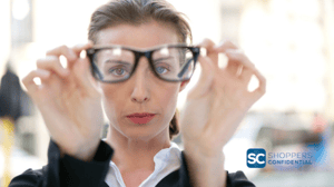 A Woman Looking Through Glasses Away From Her Face For Perspective with a A Shoppers Confidential Logo