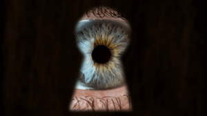 Eye peering through a key hole showing unlocking the insights into the competition.